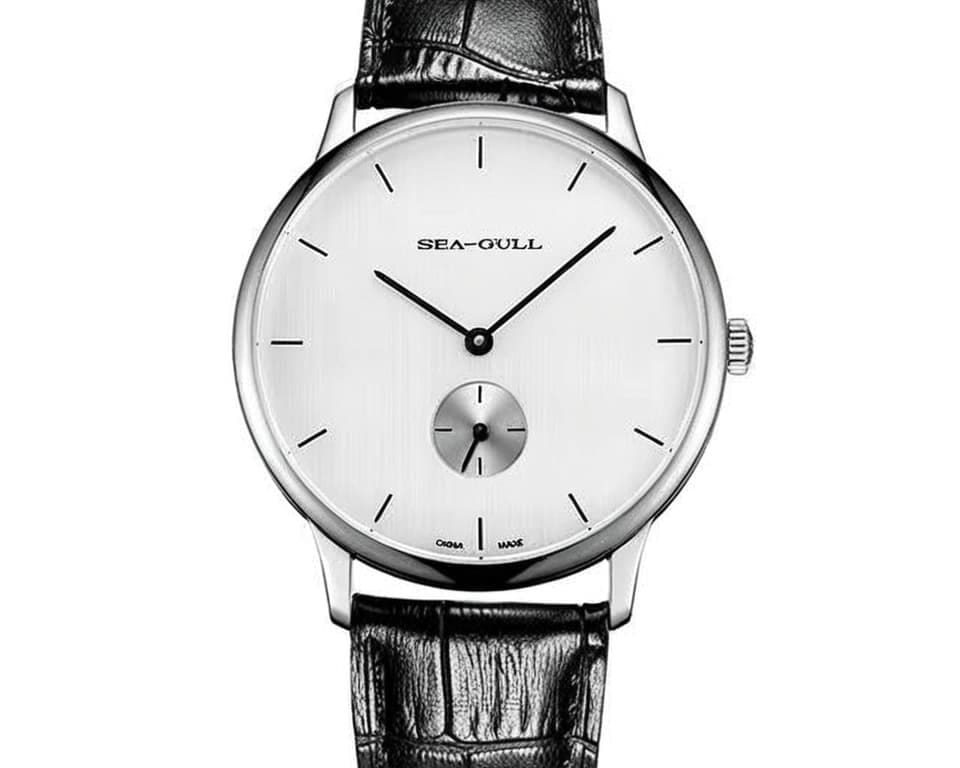 Seagull manual wind dress watch featuring clean white dial with small seconds subdial at 6 o'clock and black crocodile leather strap