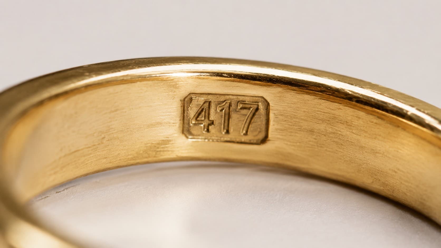 417 stamp engraved inside a gold ring band