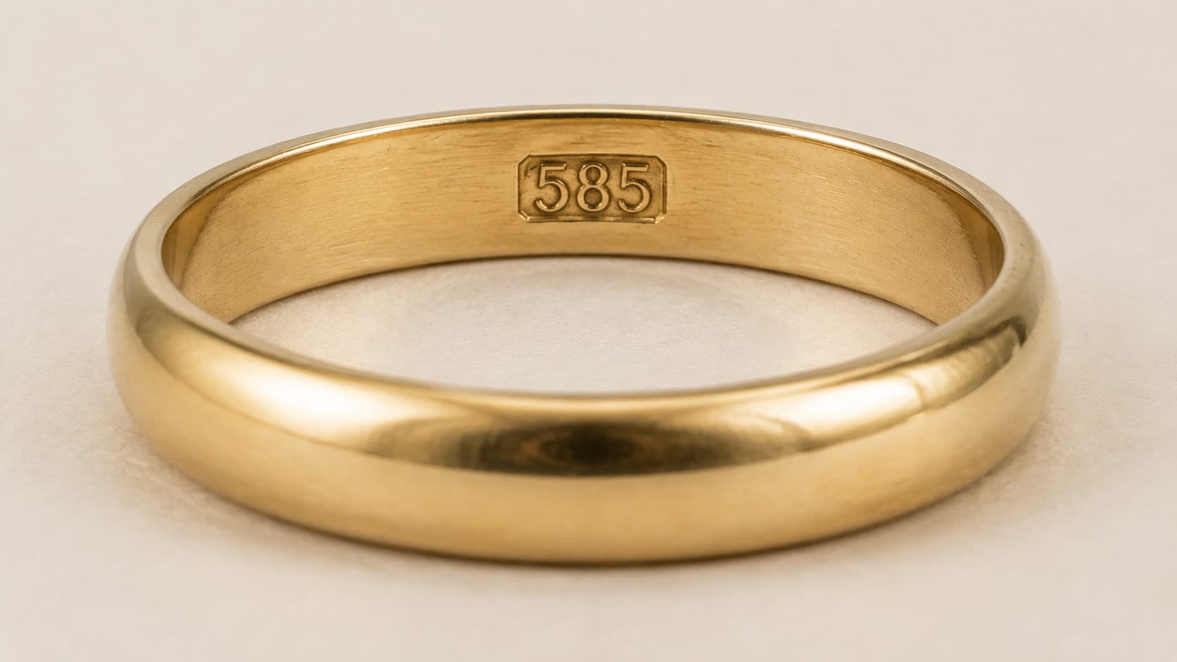 Gold ring with 585 stamp engraved inside the band, showing 14K gold hallmark