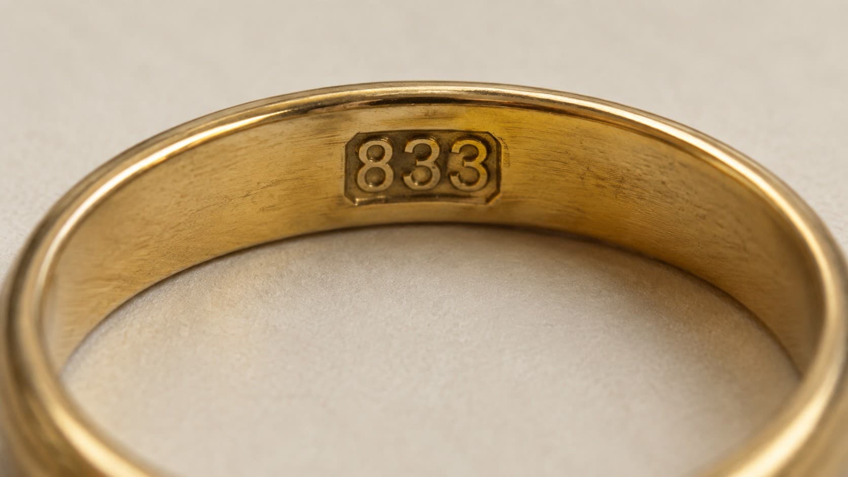 833 gold stamp engraved inside a ring band showing 20K gold purity