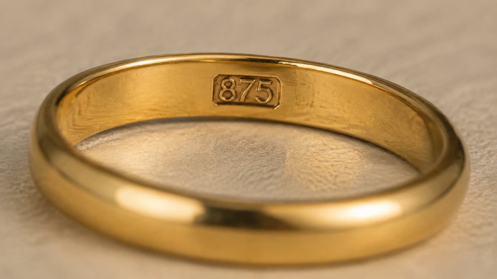 Macro close-up of an 875 purity stamp inside a gold ring