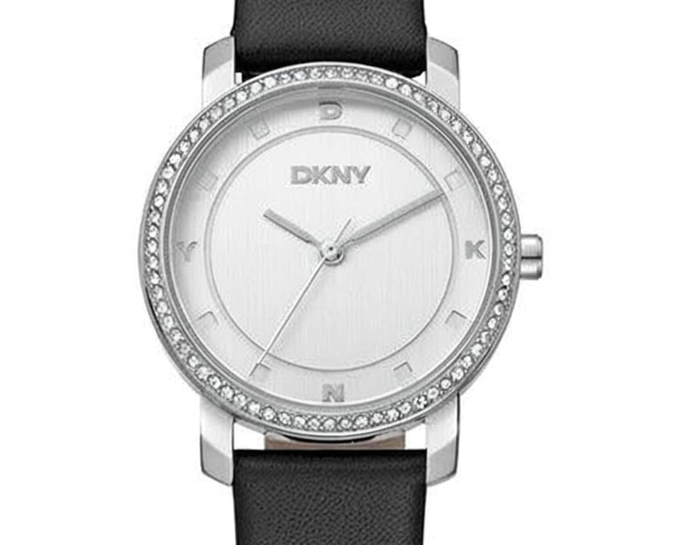 DKNY silver watch with crystal-set bezel, letter markers and black leather strap