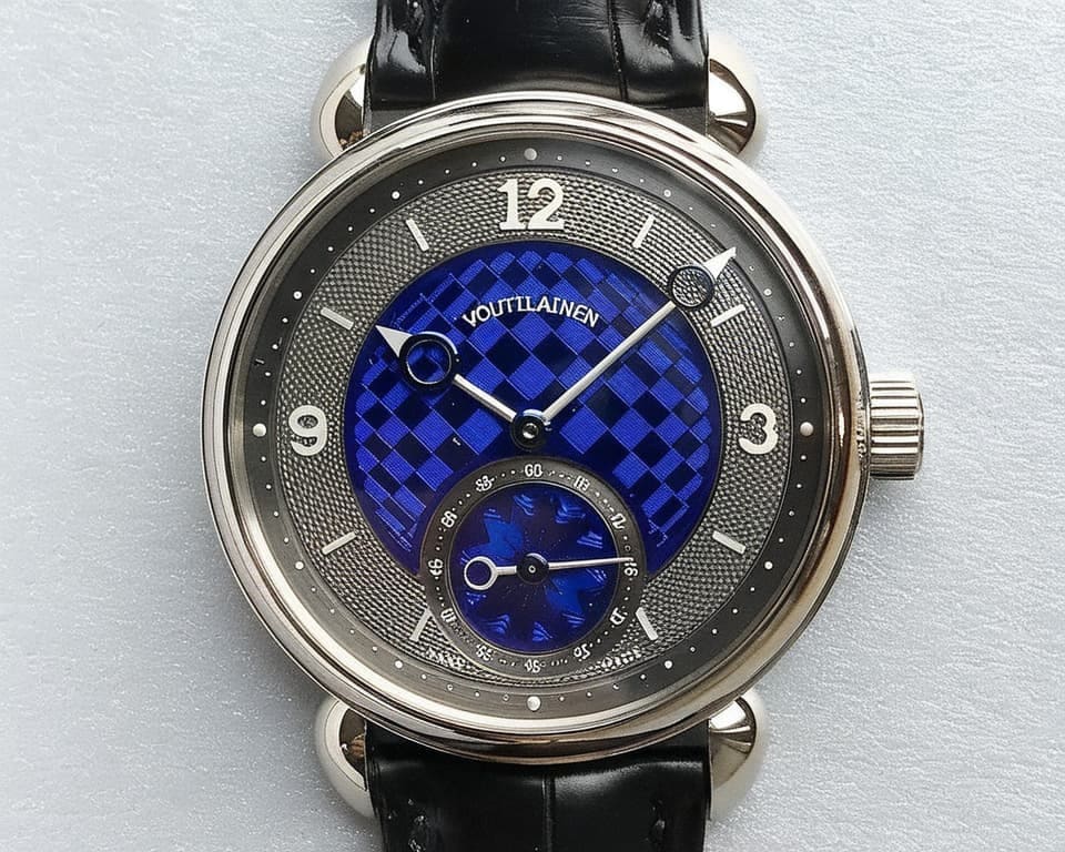 Voutilainen watch with blue checkered guilloche dial and silver hobnail border