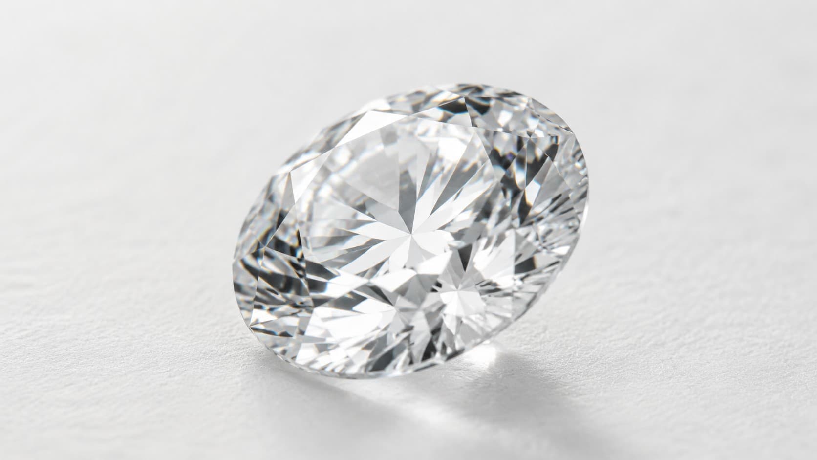 April birthstone diamond in oval cut on a white background