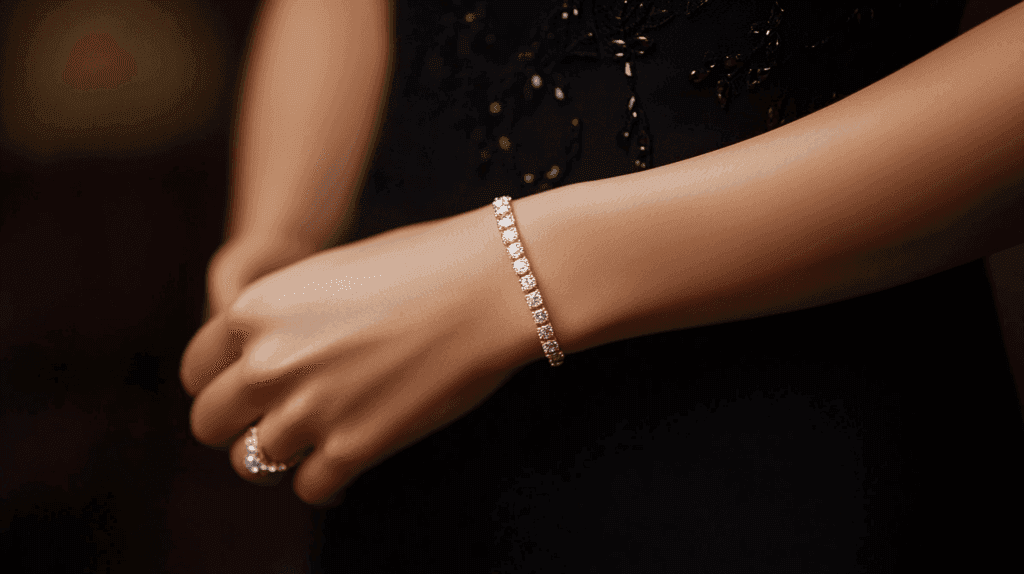Close-up of a woman’s wrist adorned with a diamond tennis bracelet and a ring, a classic jewelry choice for refined elegance at black tie events.