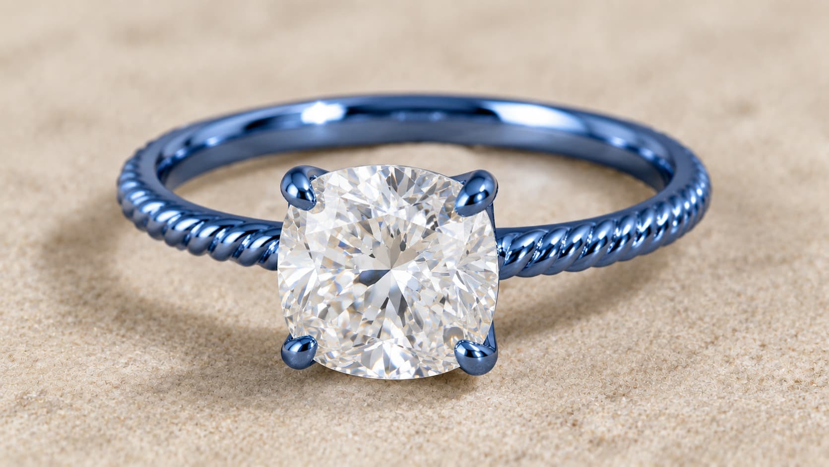 Blue gold engagement ring with cushion cut diamond and twisted rope band