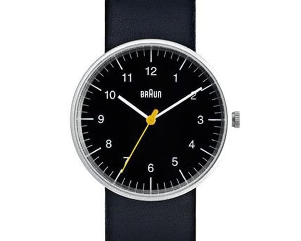 Braun watch with minimalist black dial, yellow seconds hand and black leather strap