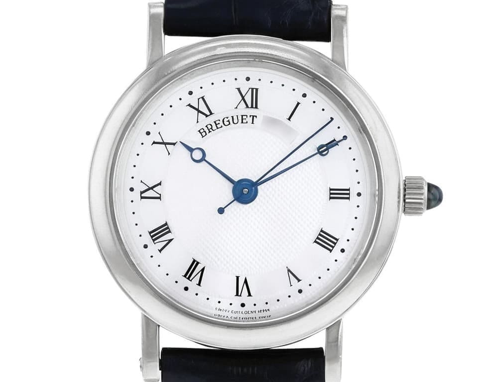 Breguet dress watch with white gold case, white guilloché dial, blue steel hands, and Roman numerals showcasing classic Swiss luxury timepiece design