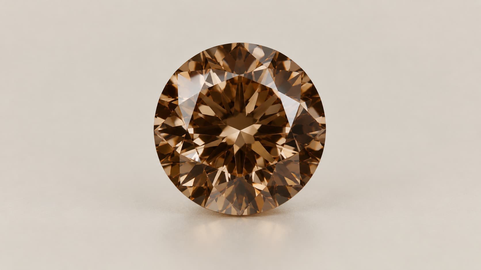 A loose round brilliant-cut brown diamond with warm champagne-brown color and strong brilliance, photographed face-up on a neutral background