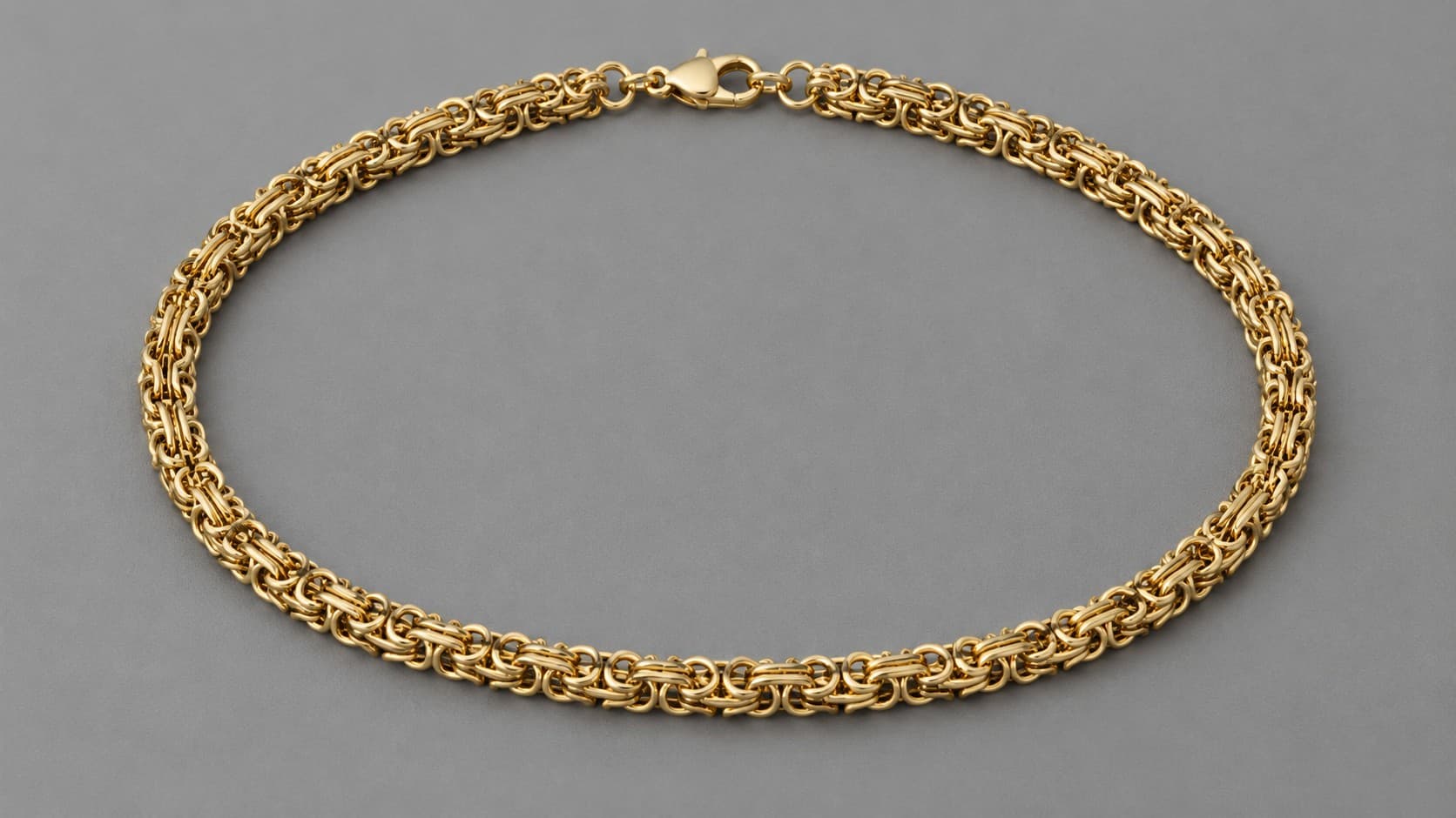 Gold byzantine chain necklace with an intricate woven link pattern