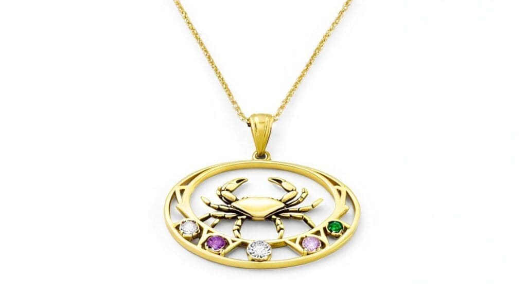 Gold Cancer zodiac pendant featuring detailed crab symbol with colorful gemstone accents