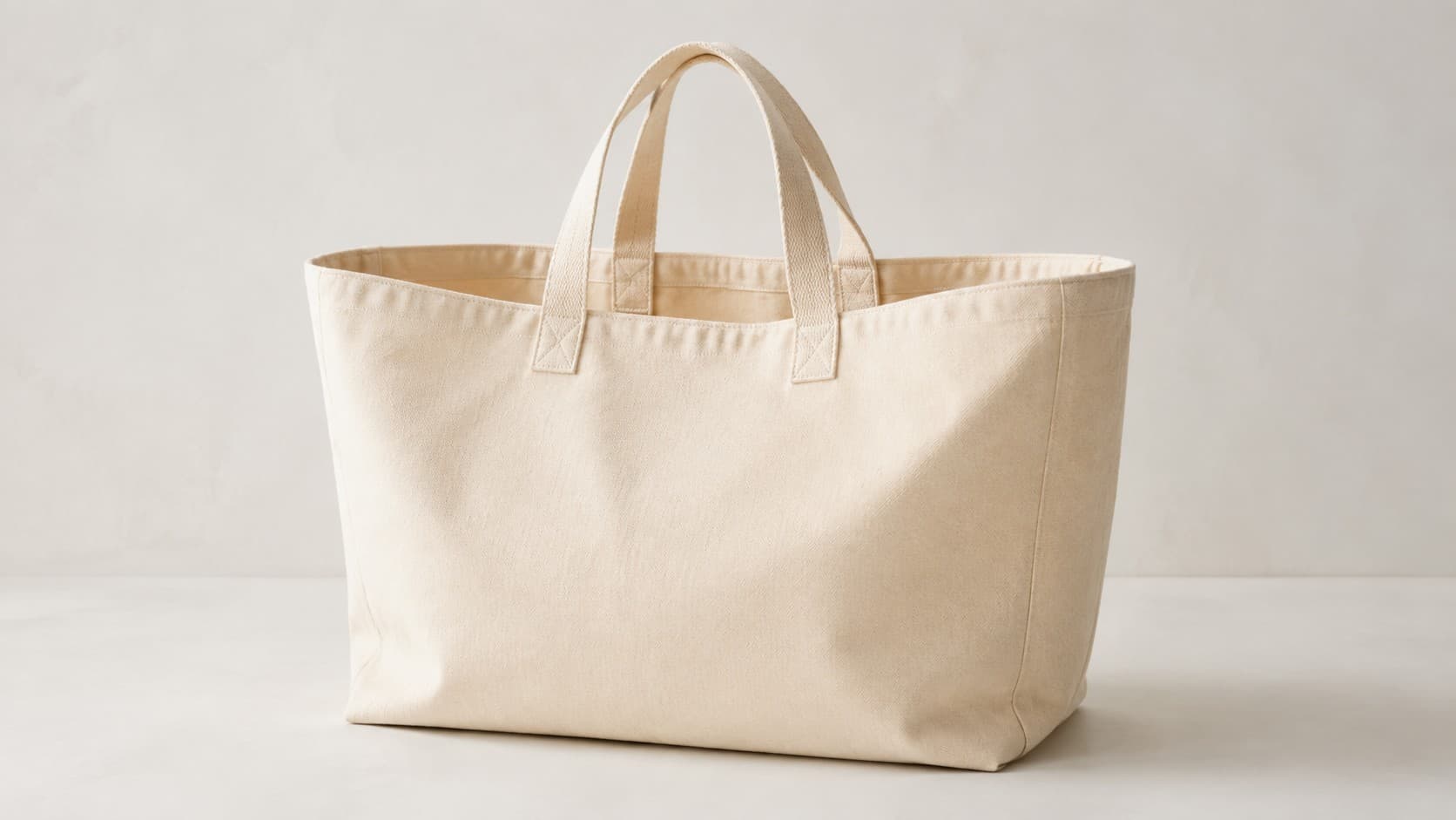 Beige canvas tote bag with two short handles