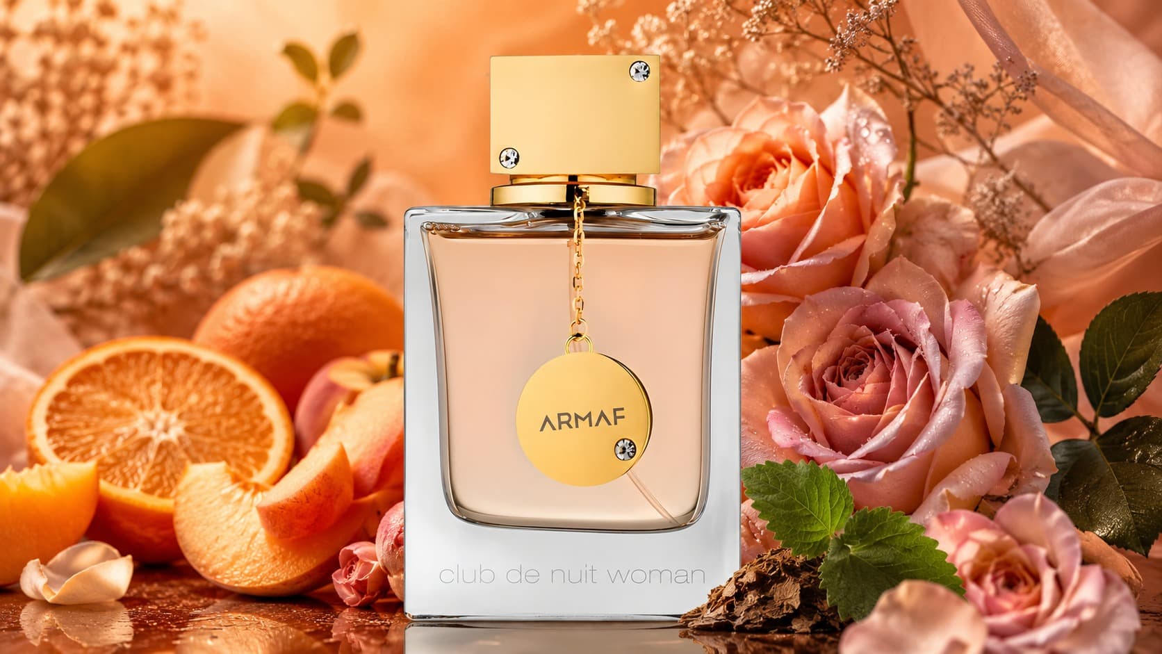 Armaf Club de Nuit Woman bottle with orange, peach, rose, and patchouli