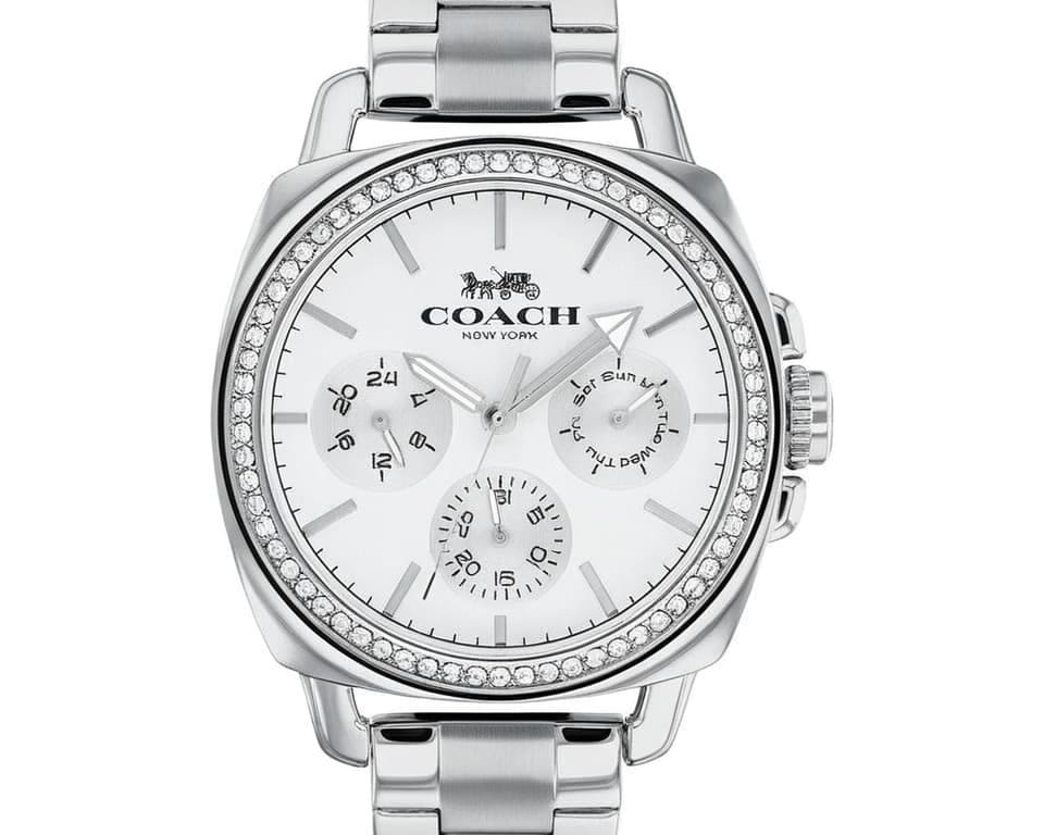 Coach chronograph watch featuring white dial with three subdials, crystal-set bezel, horse and carriage motif, and stainless steel link bracelet for luxury appeal