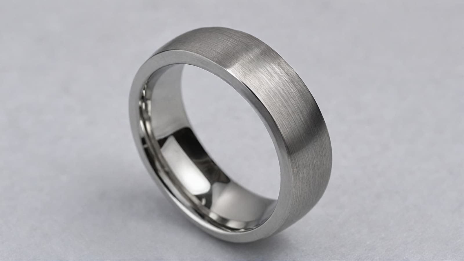Brushed cobalt men's wedding band with polished bevelled edges on grey