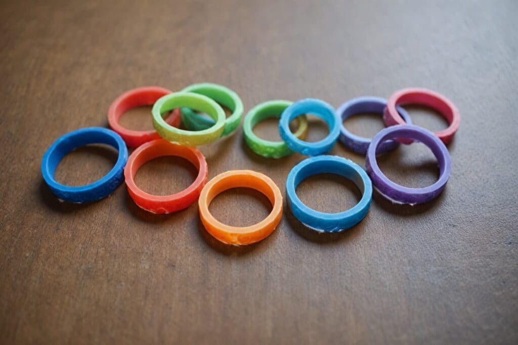Collection of colorful silicone rings as safe alternatives to metal rings during weightlifting and exercise