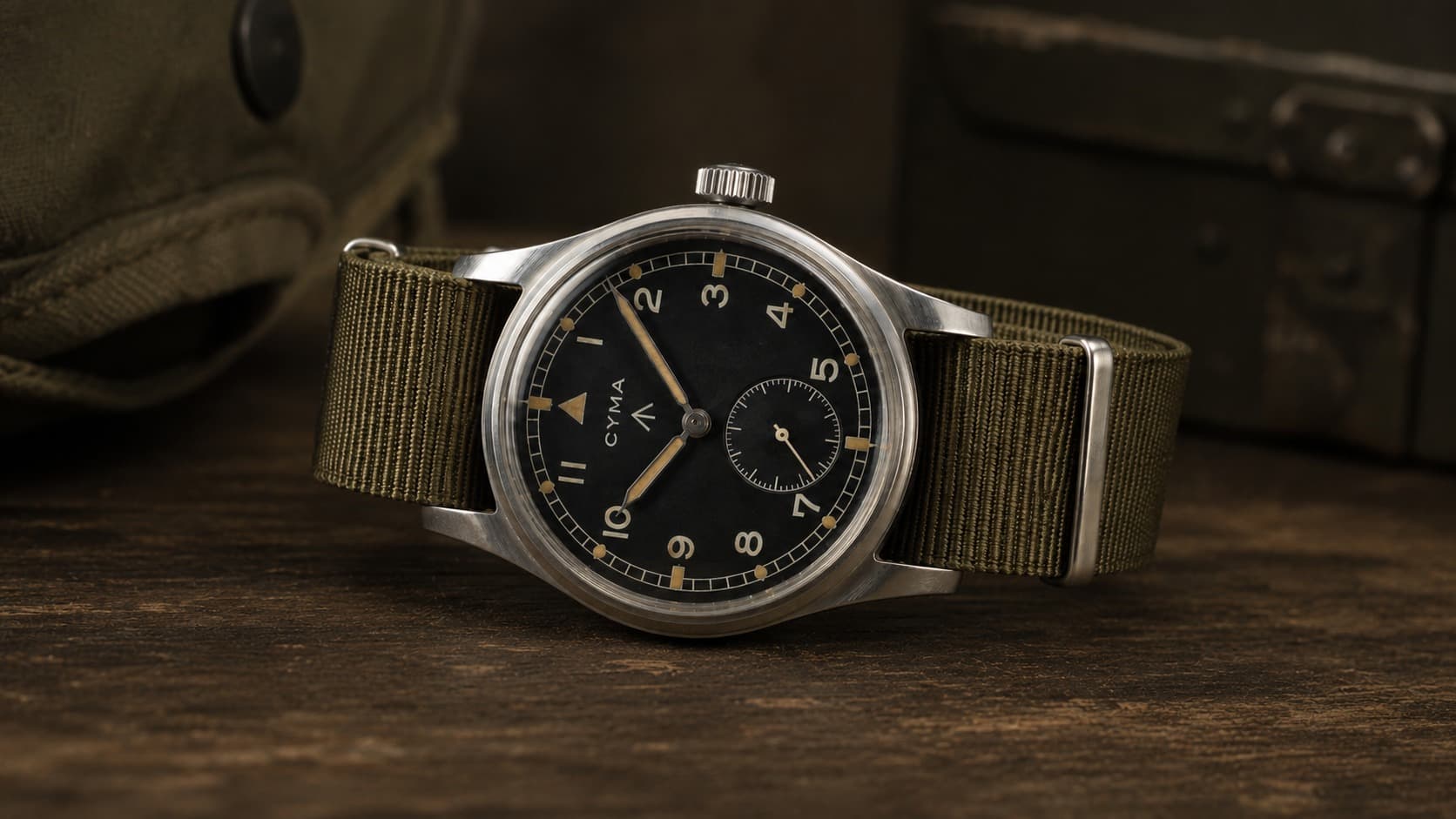 Cyma Dirty Dozen WWW military watch with black dial on an olive NATO strap