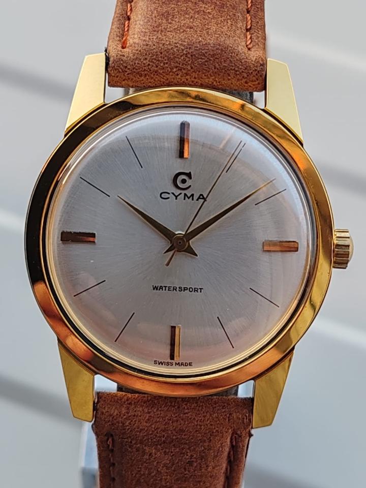 Vintage gold Cyma Watersport watch with white dial and brown leather strap