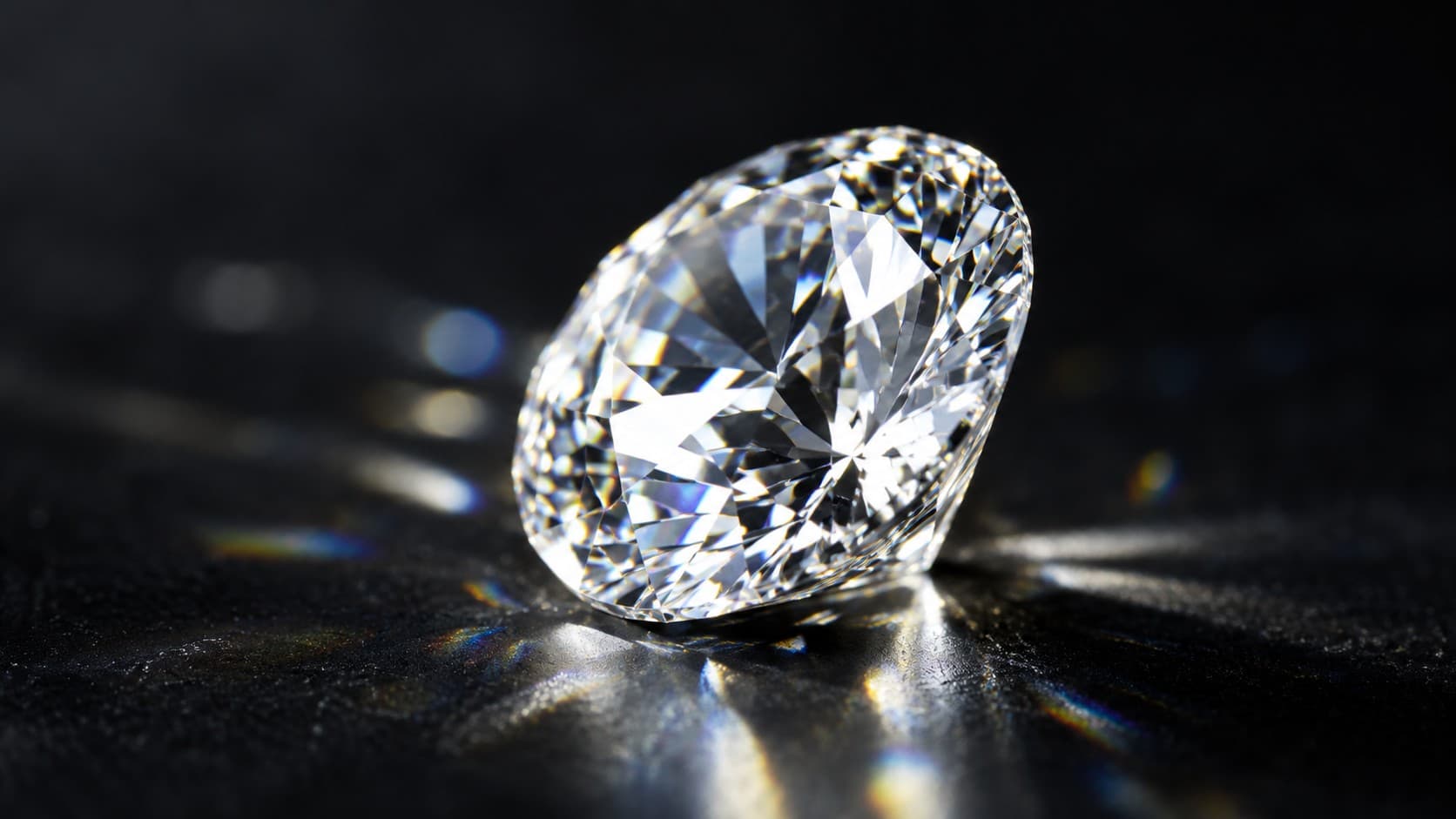 Macro close-up of a polished round diamond showing sharp facets and light refraction on a dark background