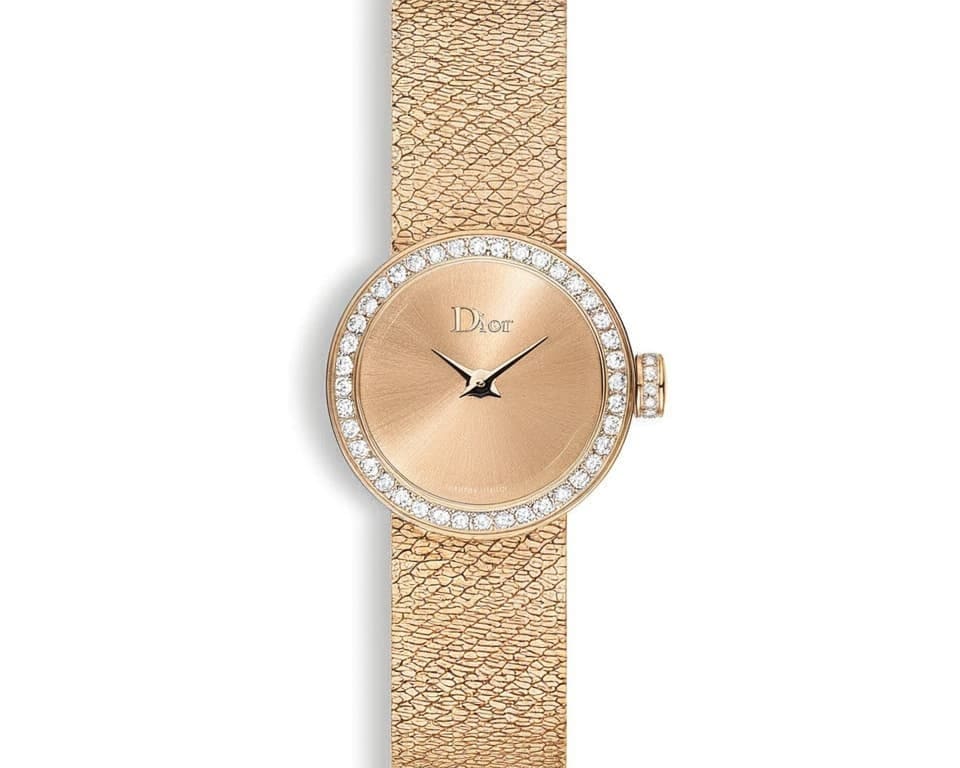 Dior La Mini D de Dior watch in rose gold with diamond bezel and textured mesh bracelet showcasing French luxury watchmaking