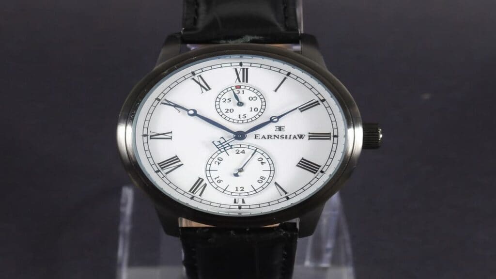 Earnshaw watch with white dial featuring Roman numerals and dual time subdials showing classical design elements