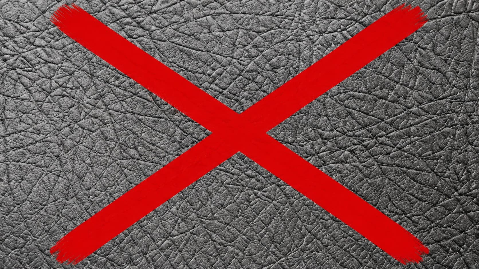 Elephant leather marked with a red X, symbolizing its worldwide trade ban under CITES