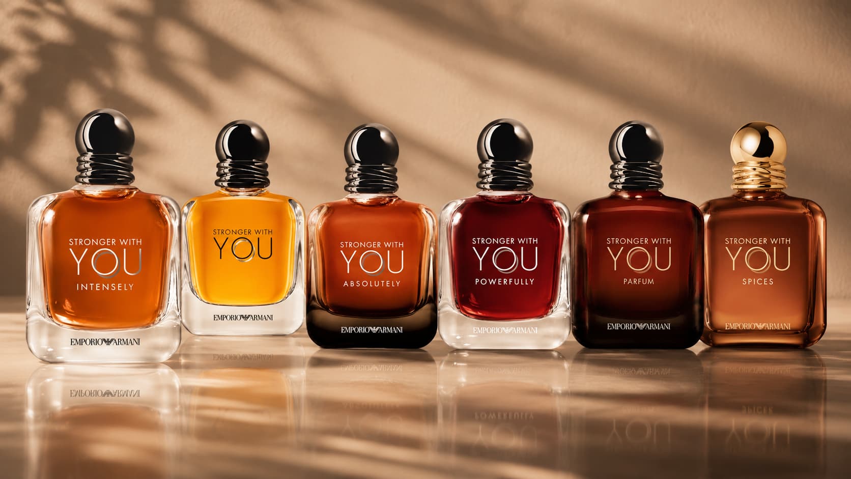 Six Emporio Armani Stronger With You flanker fragrance bottles lined up