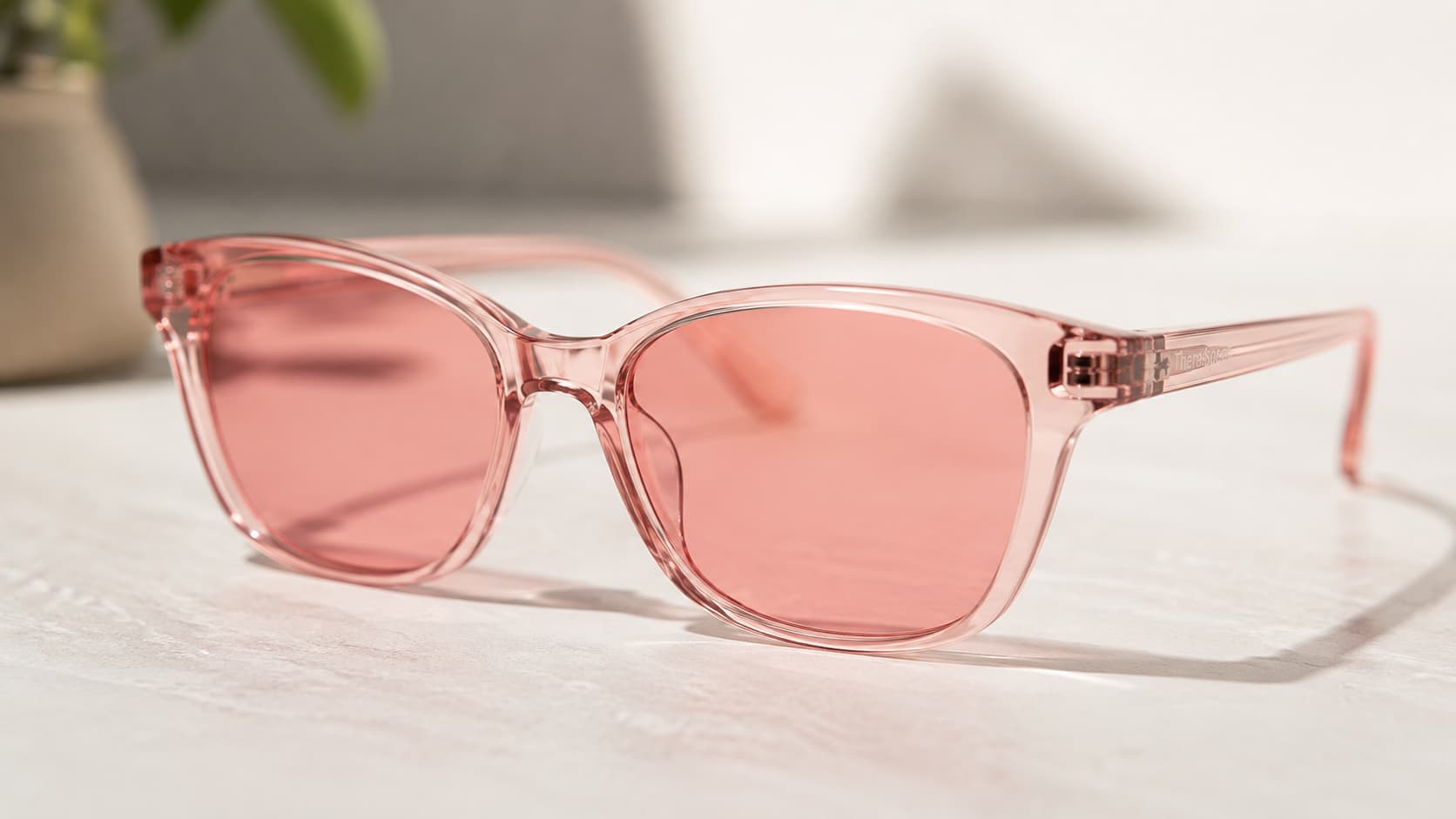 Close-up of pink-tinted FL-41 sunglasses lens