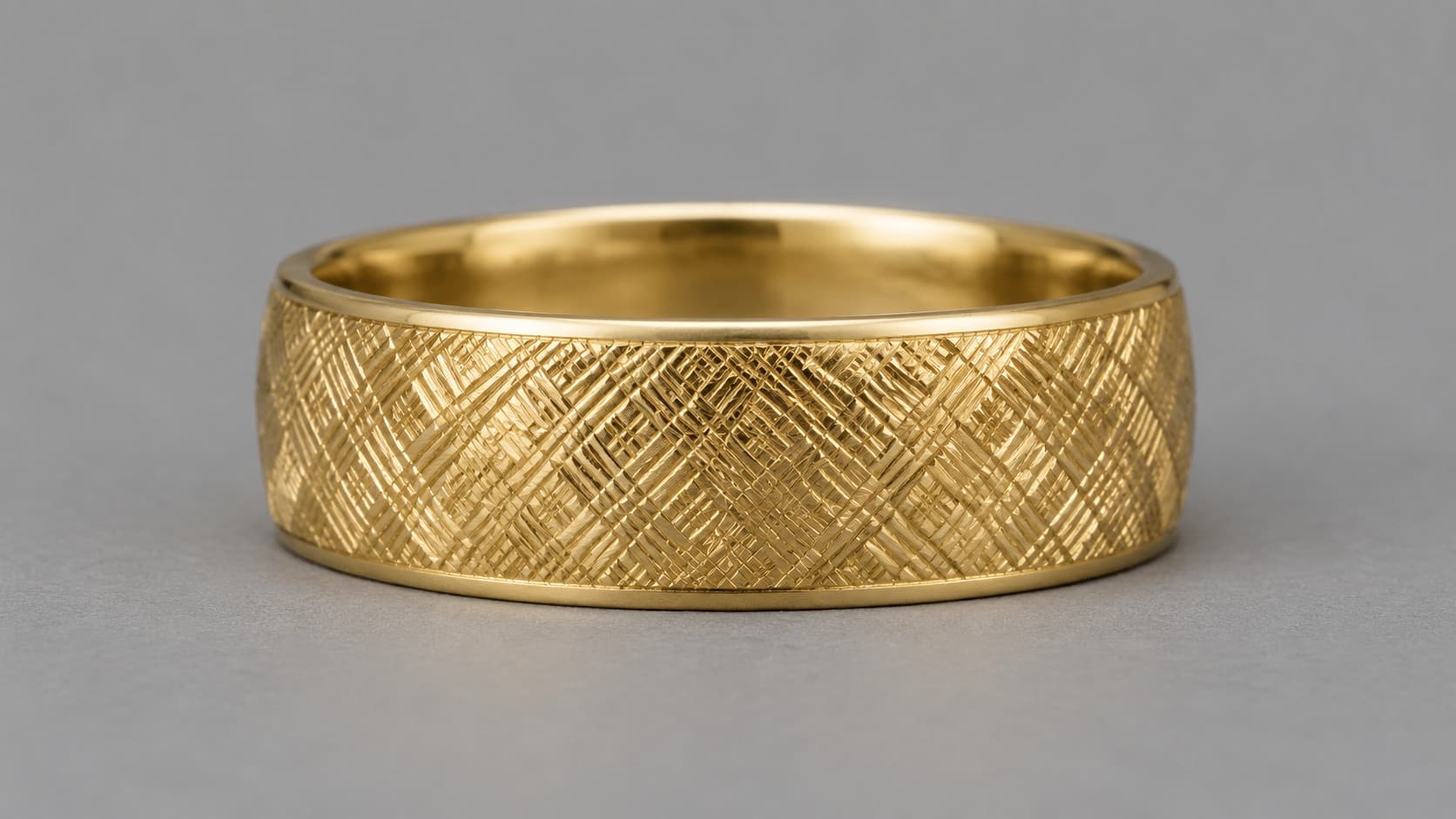 Gold ring with a hand-engraved Florentine crosshatch finish