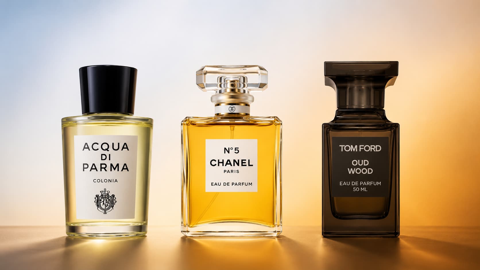 Three fragrance bottles arranged in a pyramid, from bright top notes to warm base notes
