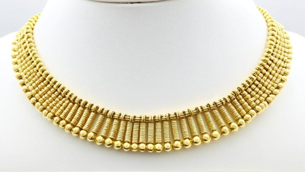 Georgian era gold necklace demonstrating cannetille technique with fine wire coils and beaded elements characteristic of post-Napoleonic jewelry craftsmanship