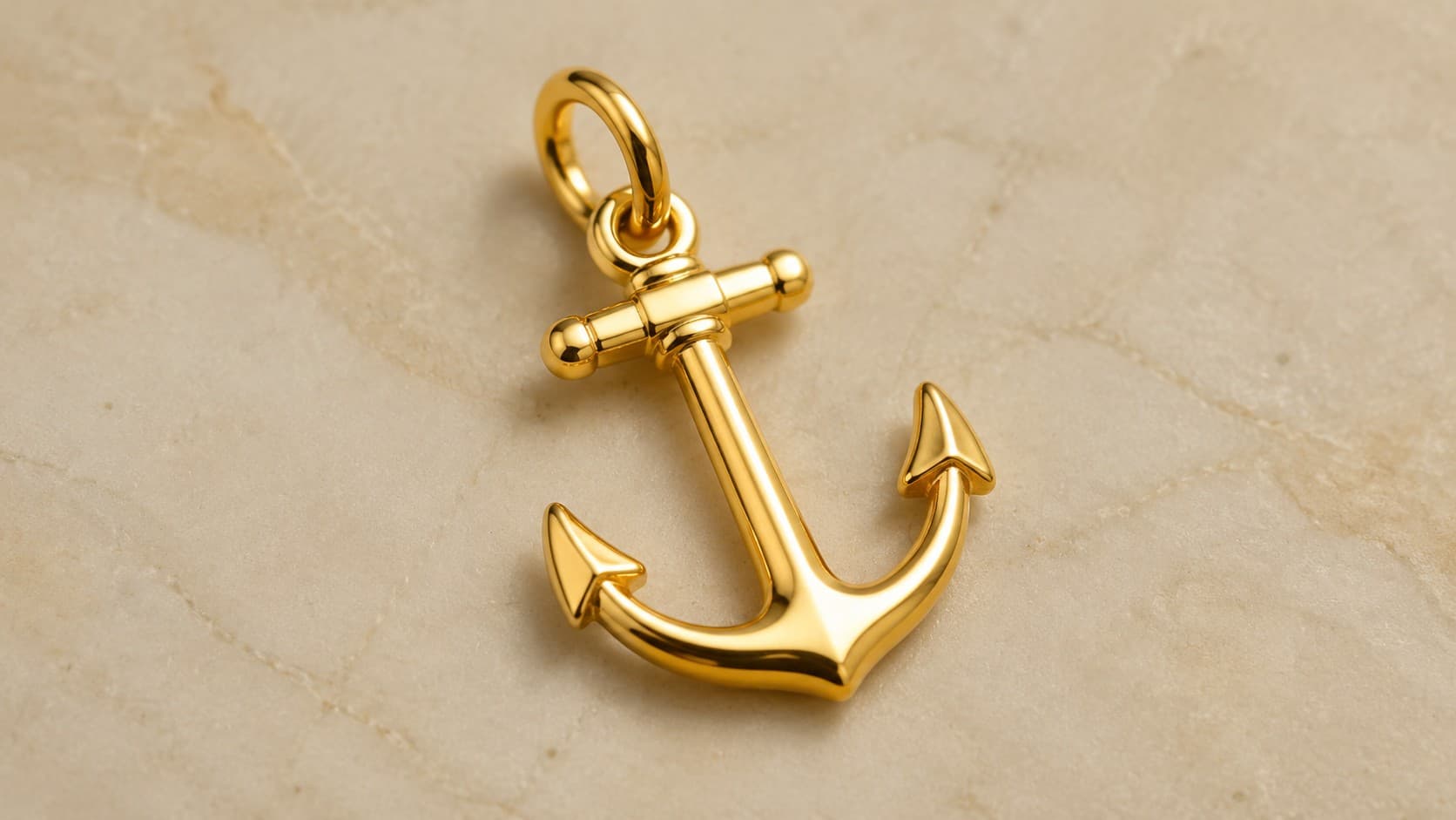 Gold anchor charm symbolizing stability and hope