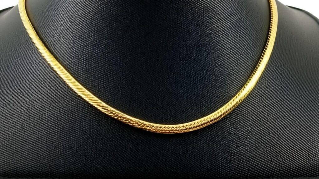 Yellow gold herringbone chain necklace requiring professional jewelry appraisal for insurance coverage