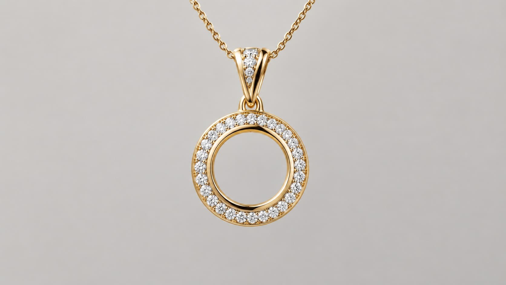 Gold circle pendant necklace with a pavé diamond halo design