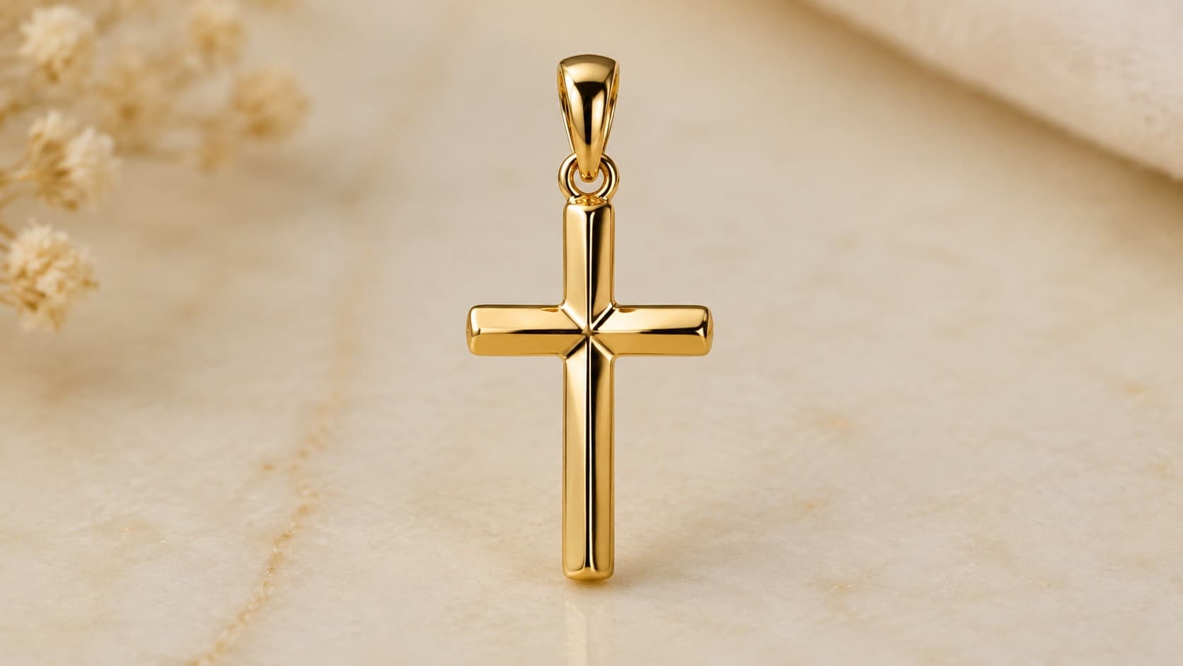 Gold cross pendant symbolizing Christian faith