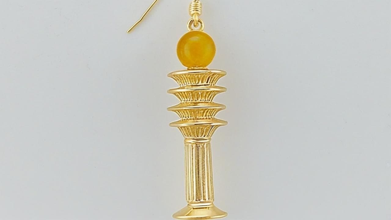 Gold djed pillar drop earring topped with a yellow stone bead
