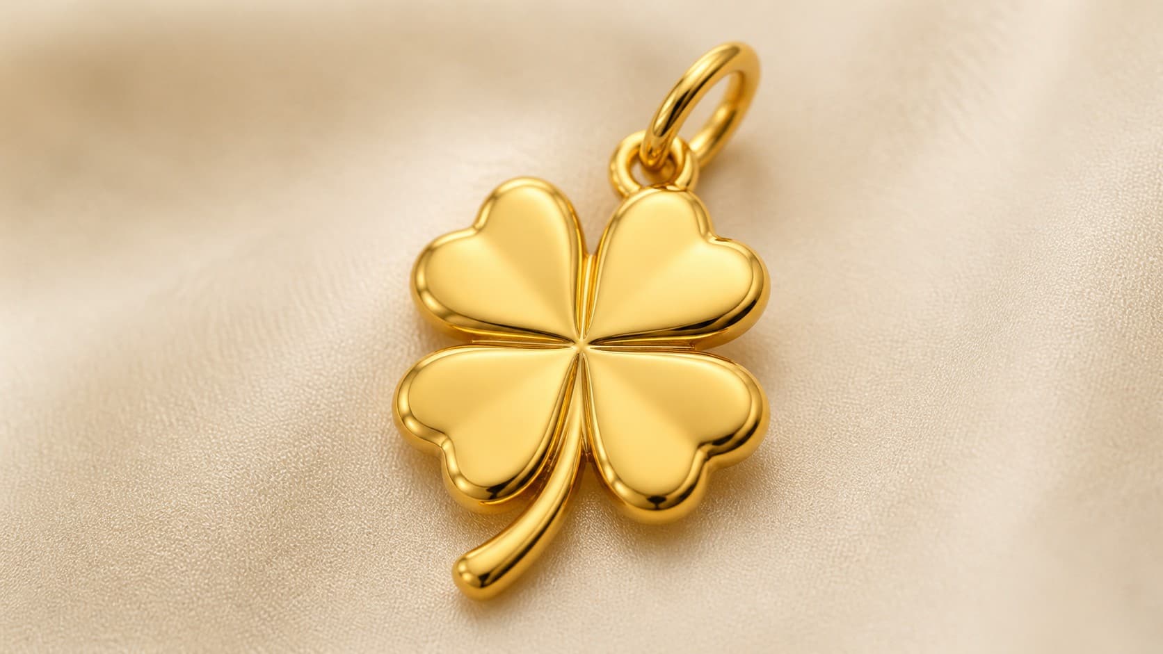 Gold four-leaf clover charm symbolizing luck