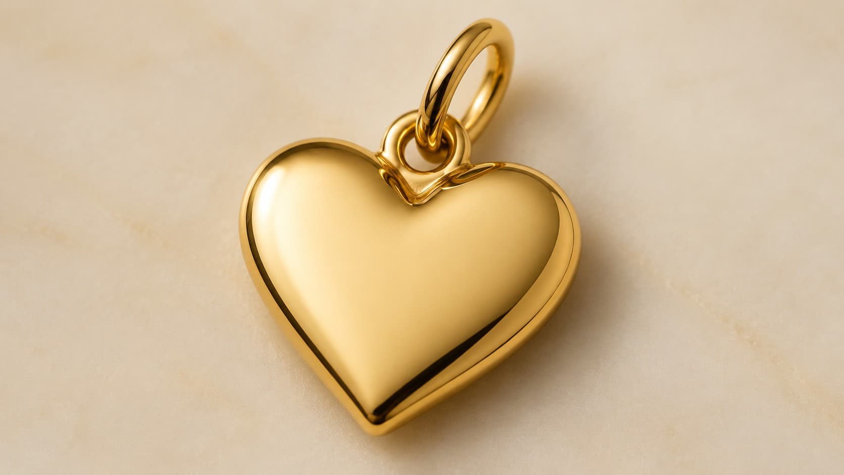 Gold heart-shaped jewelry charm symbolizing love