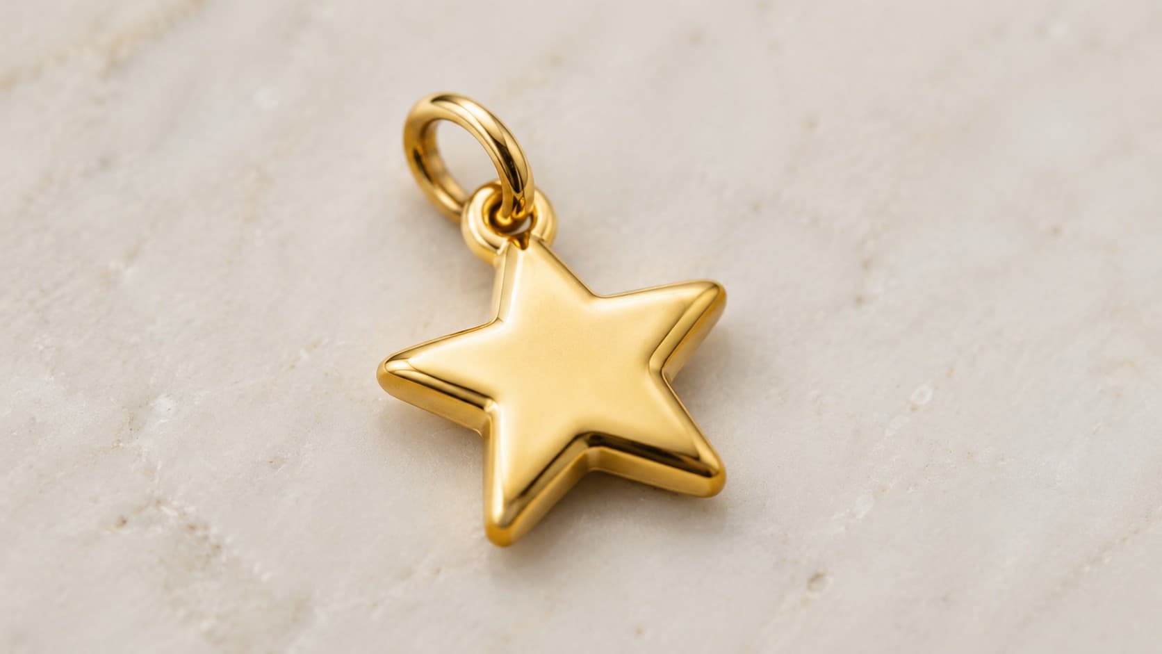 Gold star charm symbolizing guidance and hope