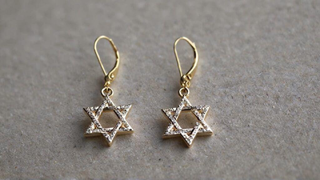 A pair of gold Star of David earrings adorned with small diamonds, symbolizing Jewish tradition and elegance in fine jewelry.