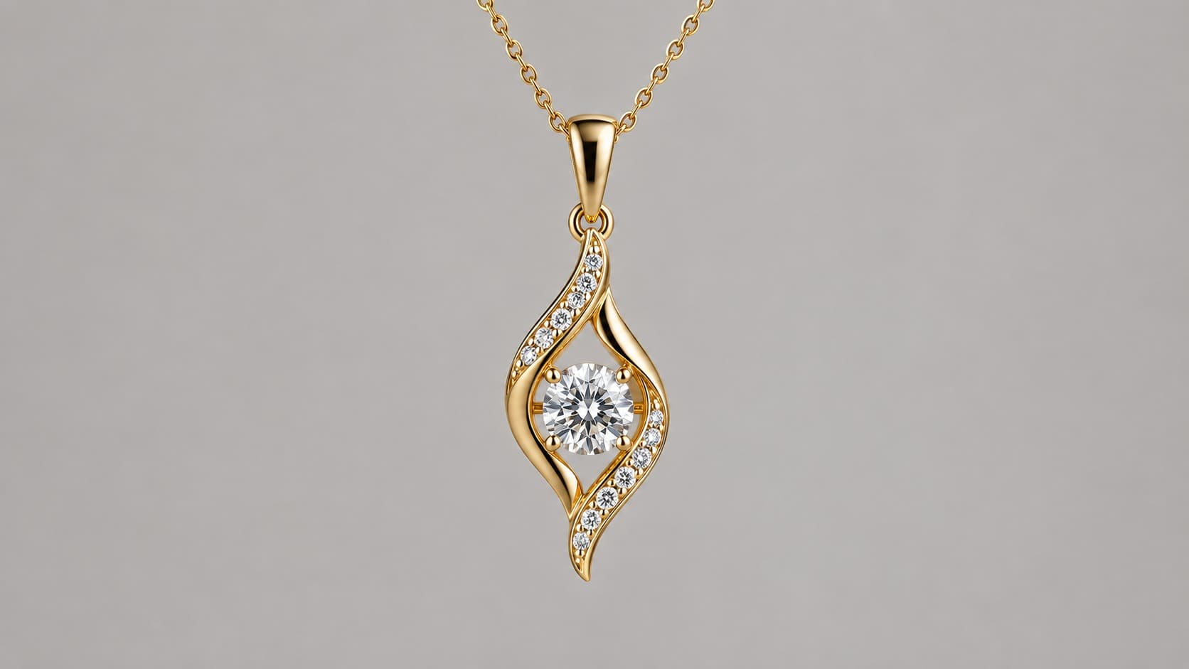 Gold teardrop pendant necklace with a round center diamond