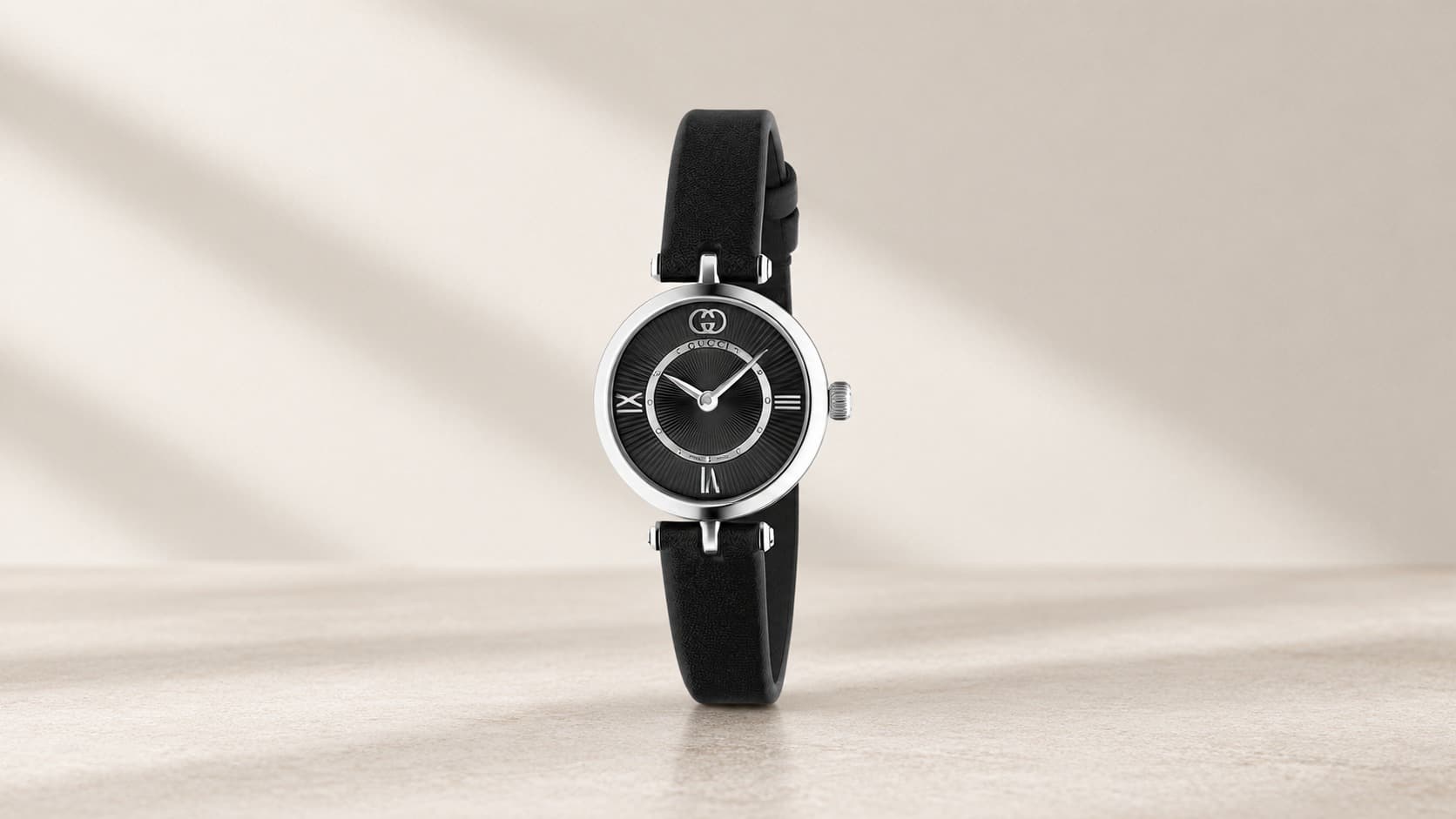 Gucci Model 2000 watch with 24mm case and black leather strap