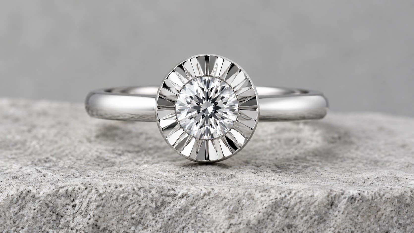 Close-up of an illusion setting ring showing the fluted metal plate around the diamond