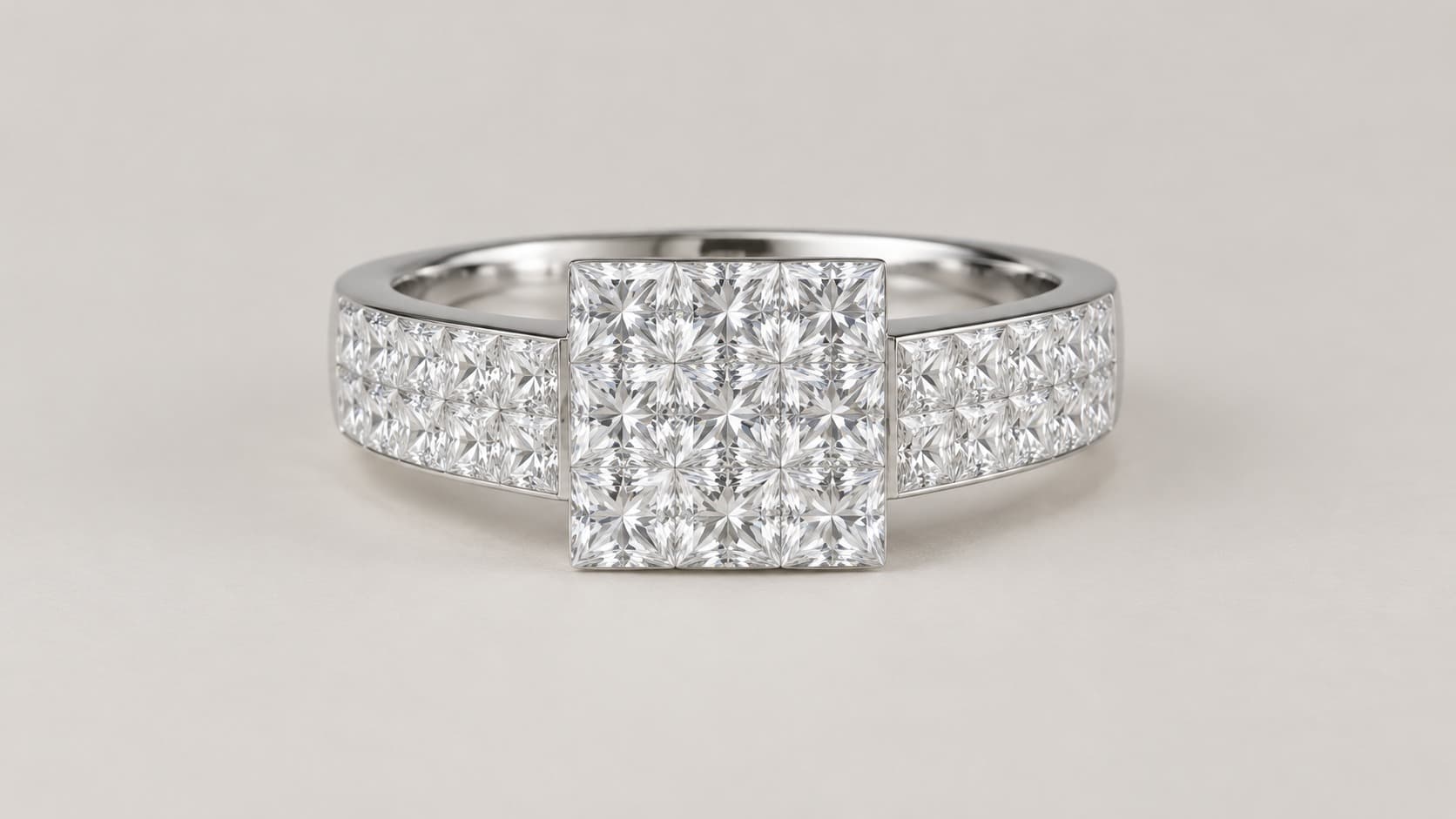 Front view of an invisible-set diamond ring where princess-cut stones sit edge to edge with no visible prongs