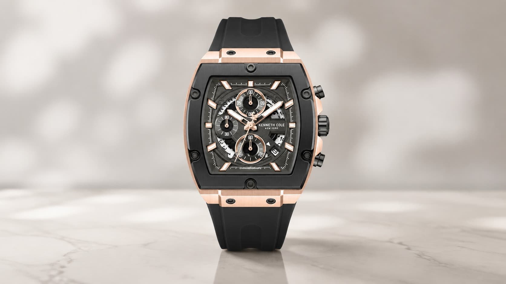 Kenneth Cole New York chronograph sport watch with a black dial and silicone strap