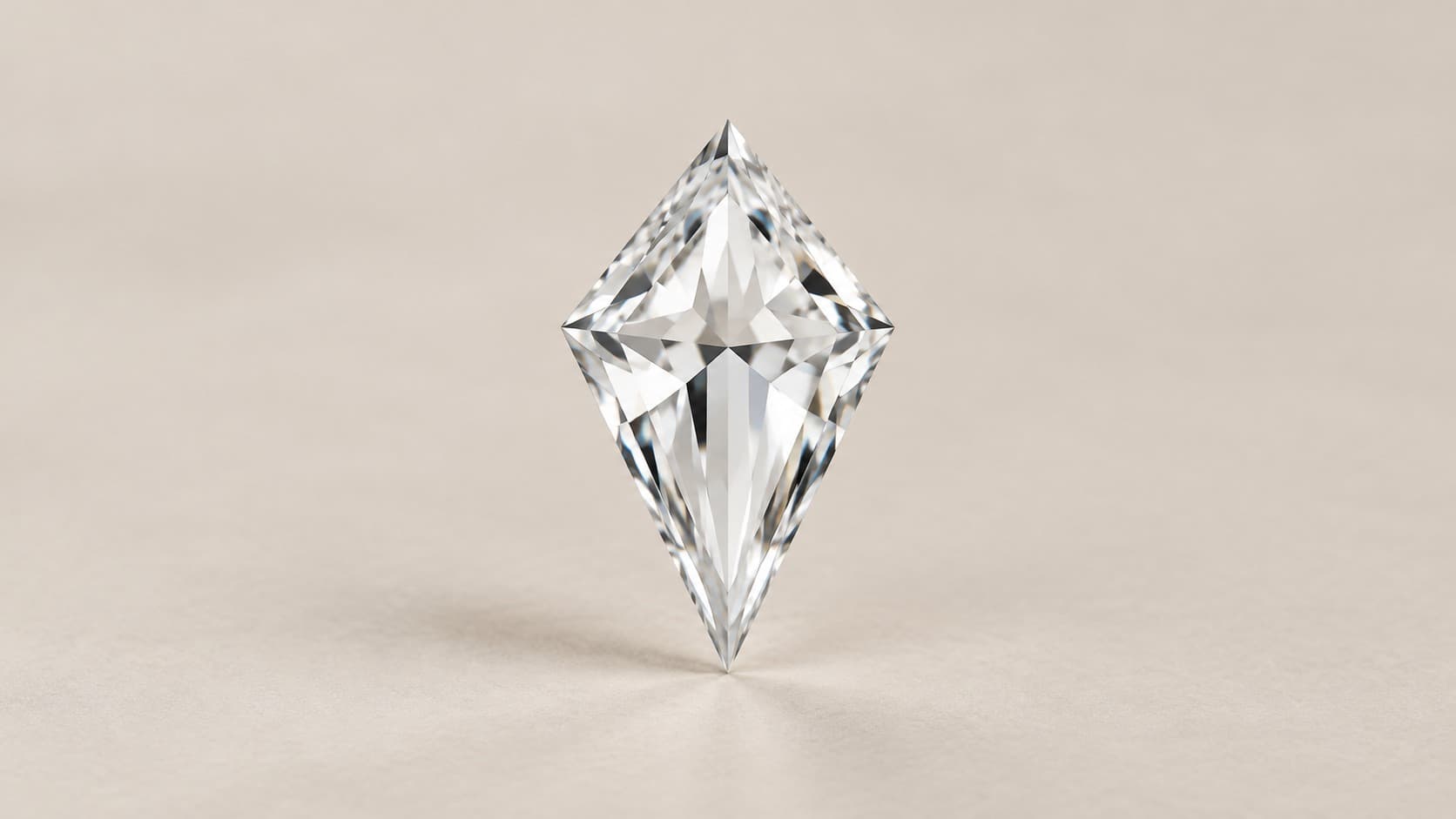 Loose kite cut diamond showing its step-cut facets and pointed tips