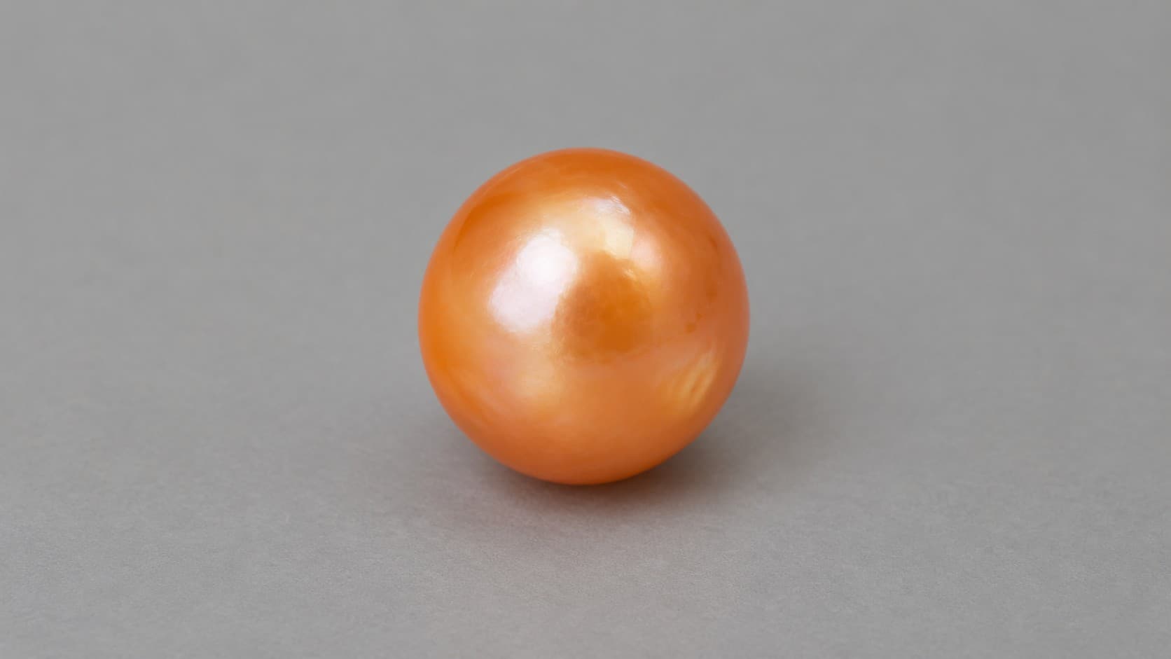 Rare orange melo pearl with a glossy surface