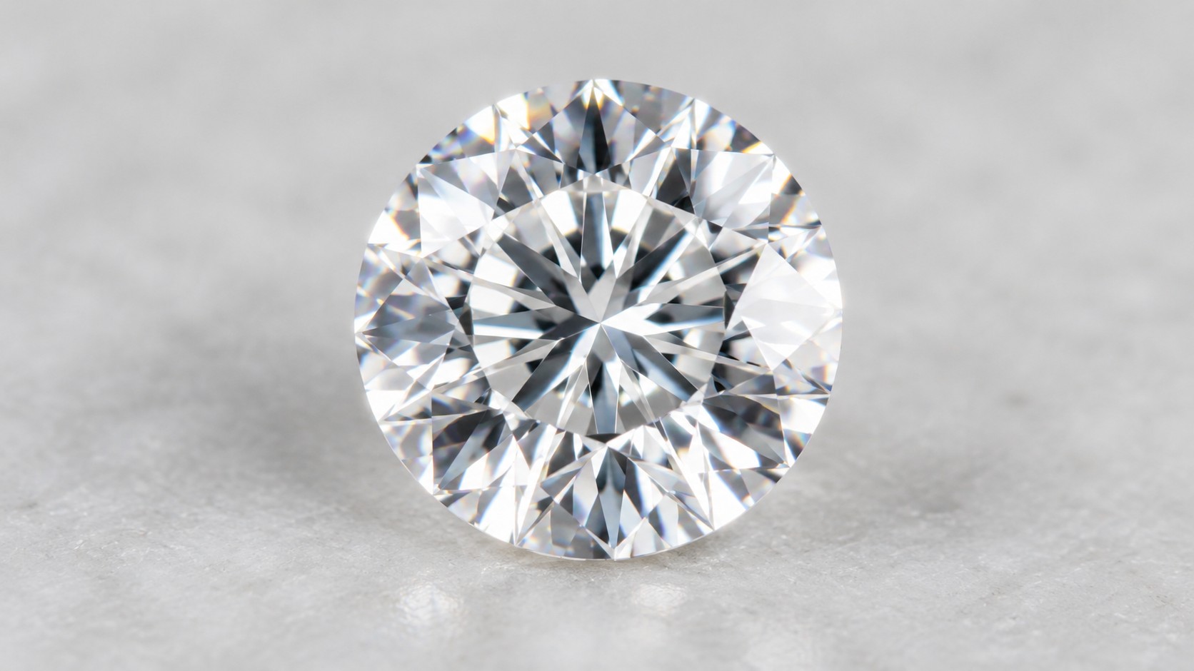 Sparkling round colorless moissanite gemstone on a neutral background