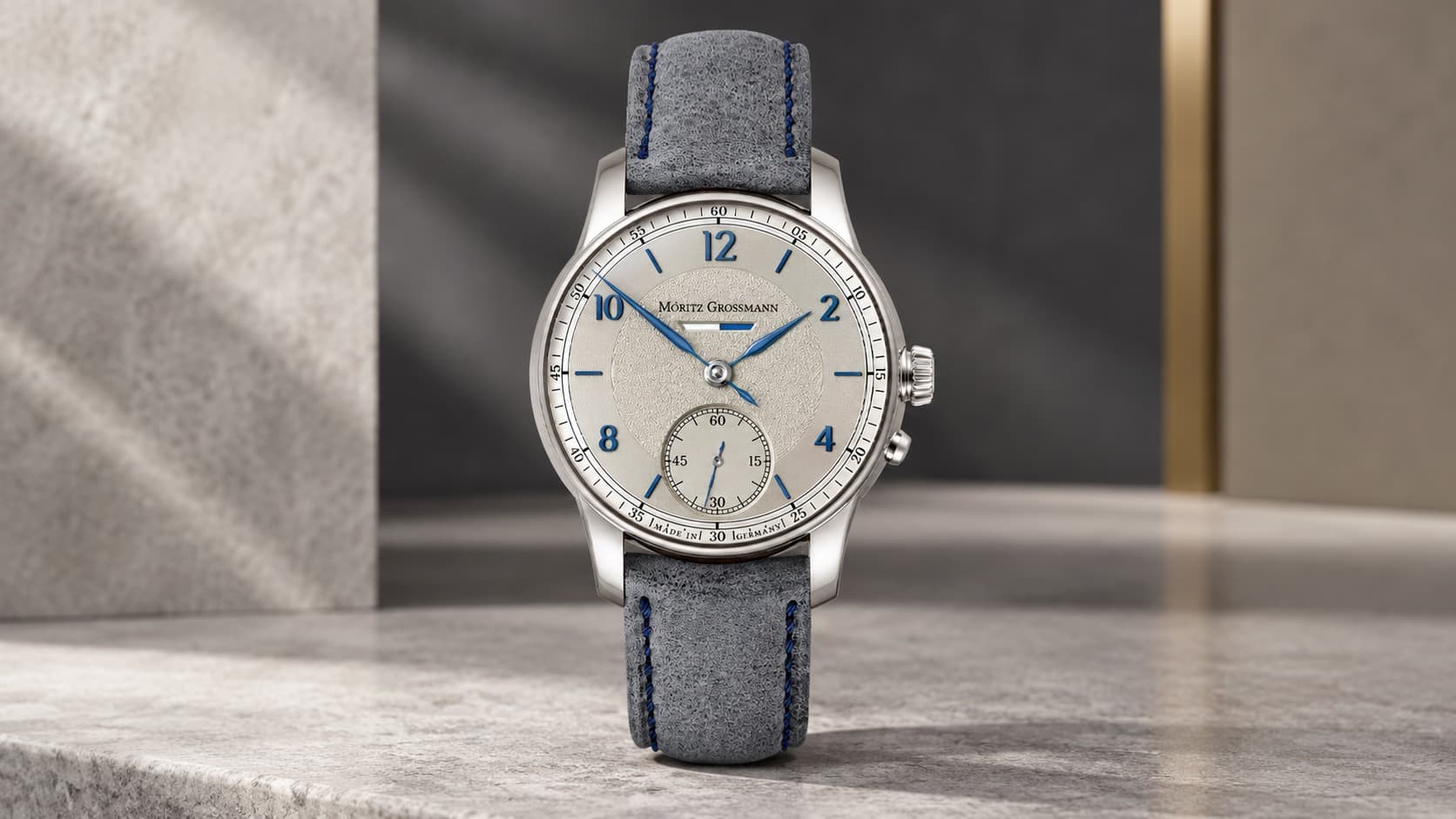 Moritz Grossmann Power Reserve watch with silver dial and grey leather strap