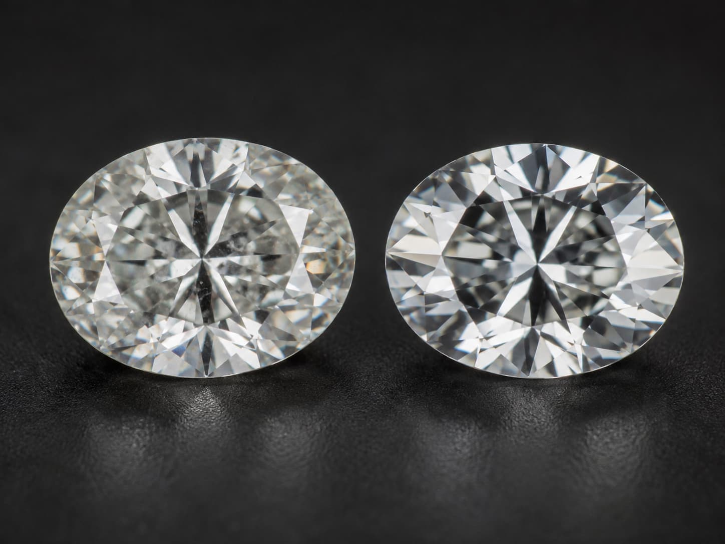 Close-up comparison of a natural diamond and a lab-grown diamond side by side